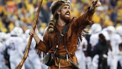 The trophies on this hunting trip include a Buffalo, a Longhorn, and a guy with a hammer.